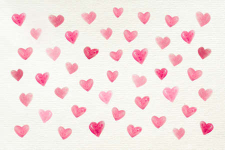 Love background with many watercolor hearts painted on a recycled white paper for Valentine's Day or other celebrations, letter, copy spaceの写真素材