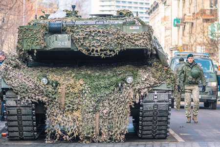Vilnius, Lithuania - February 16 2022: NATO or North Atlantic Treaty Organization armored crawler tanks and other military vehicles on the road, close upのeditorial素材