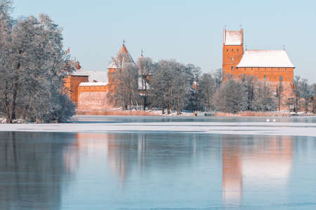Medieval castle of Trakai, Vilnius, Lithuania, Eastern Europe, located between beautiful lakes and nature with beautiful sky and blue lake in winter with snow, frozen lake and blue skyのeditorial素材