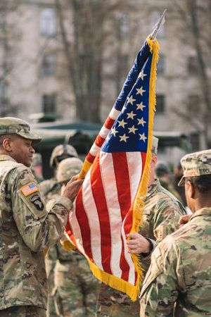 United States - March 29 2022: United States Marine Corps soldiers rolling or roll up American flag, USA or US army troops ready for drills or warのeditorial素材