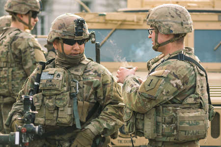 United States- March 29 2022: United States Marine Corps soldiers with shotgun, rifle, helmets and...
