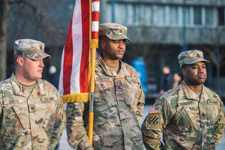 United States - March 29 2022: United States Marine Corps soldiers rolling or roll up American flag, USA or US army troops ready for drills or warのeditorial素材