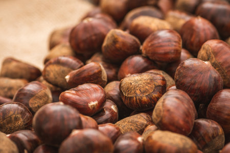 Beautiful brown ripe chestnuts in a street food market, close upの写真素材