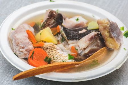 Hot fish soup with various vegetables in Kaziuko Muge or Saint Casimir's Fair, a spring annual folk arts and crafts fair in Vilnius, Lithuania, Europe, close upの写真素材