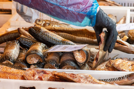 Selling various smoked fish in a street food market in Vilnius, Lithuania, Europeの写真素材