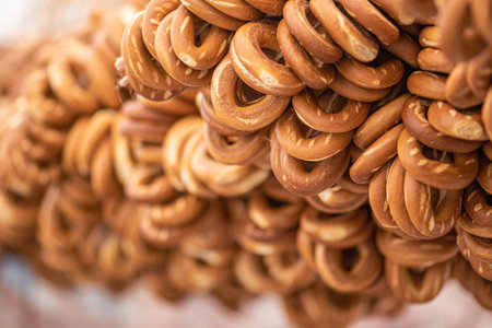 Sushki, traditional Russian, also Ukrainian and Lithuanian, Eastern European small, crunchy, mildly sweet bread rings with poppy seeds in a street food regional marketの写真素材