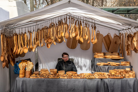 Vilnius, Lithuania - March 4 2023: Selling handmade wooden tools and objects in Kaziuko Muge or Saint Casimir's Fair, a spring annual folk arts and crafts fair in Vilnius, Lithuaniaのeditorial素材