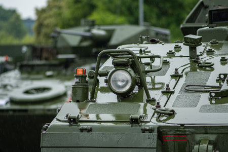 Vilnius, Lithuania - June 17 2023: Armored tanks and military infantry fighting vehicles ready to...