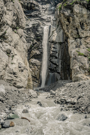 Goja del Pis waterfall among rocks and forests of the Alps in Val di Susa, Turin, Piedmont, Italy, verticalの写真素材