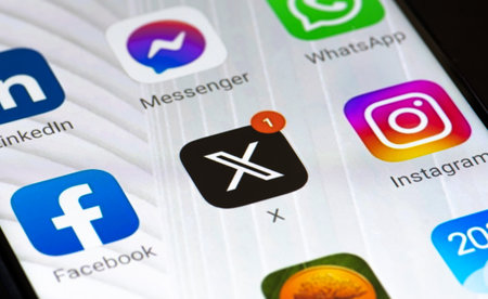 San Francisco, United States - August 30 2023: Twitter or X initial logo and app on a smartphone. Online social media and social networking service with red notification and otherのeditorial素材