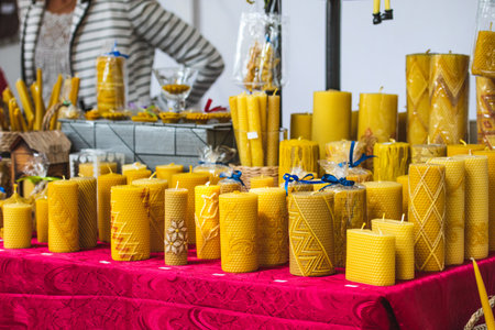 Selling organic natural bio beeswax candles in a craft marketの写真素材
