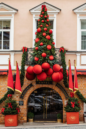 Vilnius, Lithuania - November 22 2025: A cozy, festive street in Vilnius Old Town with Christmas decorations and ornaments creating a charming holiday atmosphereのeditorial素材