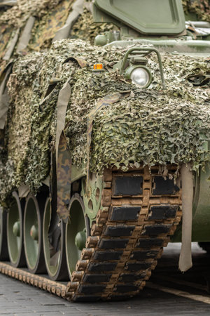 Detail of an armored tank moving on the roadの写真素材