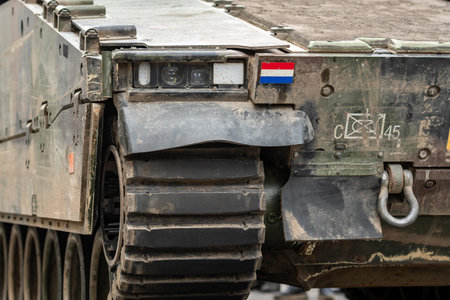 Netherlands - November 22 2025: Armored tank of the Royal Netherlands Army with Dutch flag moving on the roadのeditorial素材