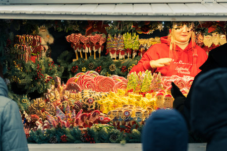 Vilnius, Lithuania - November 2025: Stall or stand with traditional colorful and festive candies and lollipops at the Christmas Marketのeditorial素材