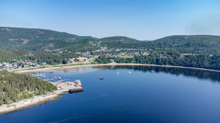 Aerial view of Tadoussac bay taken by drone over the St-Lawrence river. View of Pointe-de-L'Islet trail.の写真素材