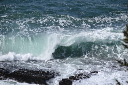 Seascape with waves breaking on the rocks in the Pacific Ocean