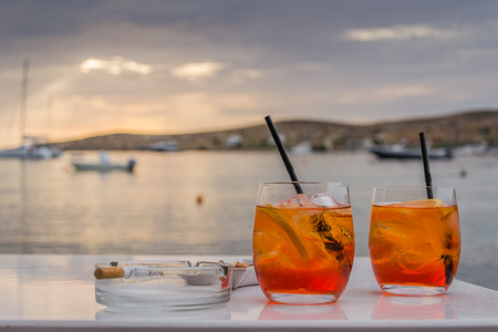 Drink on the waterfront at sunset