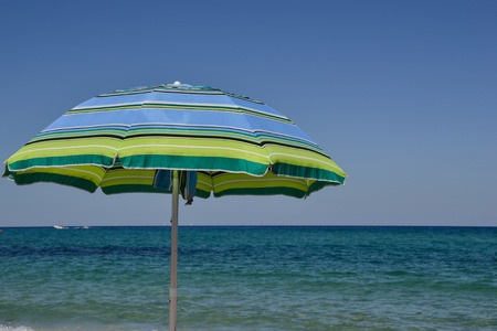 Colored umbrella in the beachの写真素材