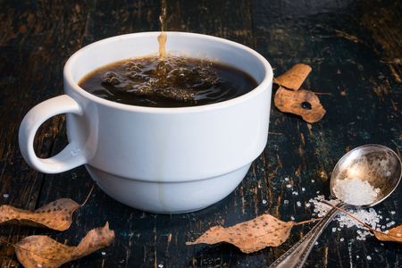 Pouring Coffee in Large white Cupの写真素材