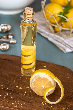 Homemade lemon extract made by infusing lemon peel in vodkaの写真素材