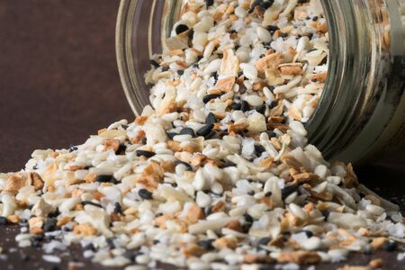 Everything Bagel Seasoning Spilled from a Jarの写真素材