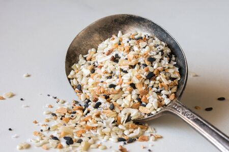 Everything Bagel Seasoning Spilled from a Spoonの写真素材