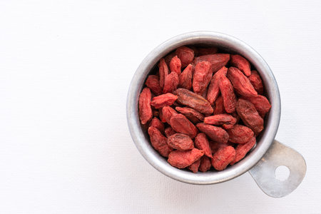 Dried Goji Berries in a Measuring Cupの写真素材