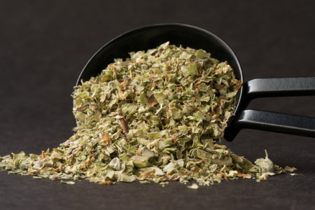 Dried Marjoram Spilled from a Teaspoon