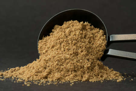 Ground Cumin Spilled from a Teaspoonの写真素材