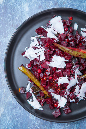 Close up of Indian beetroot poriyal topped with green chillies on a grey kitchen top. Close up sliced beetroot.の写真素材