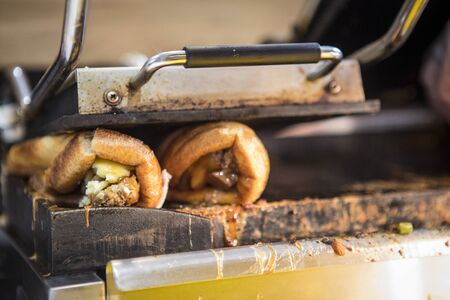 Close up of how to prepare yorkshire pudding wrap in England. Yorkshire pudding wrap on the grill.