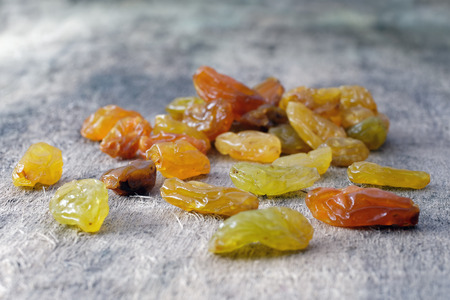 Giant juicy raisins on woodの写真素材
