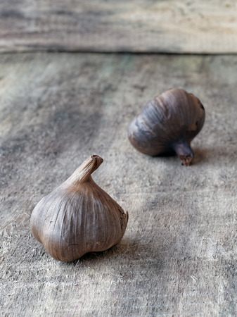 Fermented black garlic bulbsの写真素材