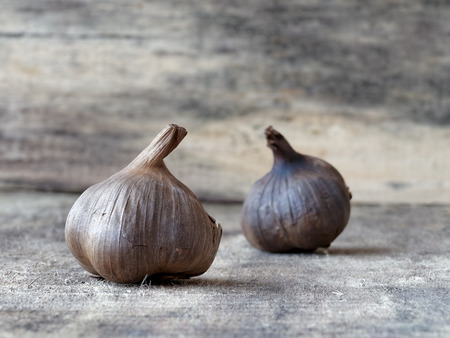 Fermented black garlic bulbsの写真素材
