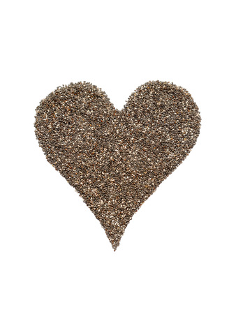Chia seeds in a heart shape isolated on whiteの写真素材