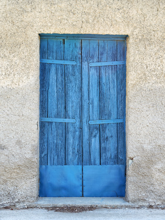 Old wooden blue door in Greeceの写真素材