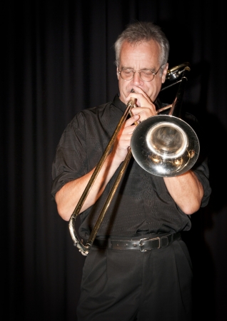 Trombonist Dave Arthur playing at the Art Centre in Ottawa, Canada.の写真素材