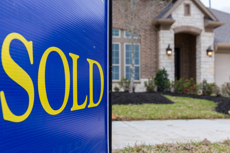 Sold sign posted in front a new construction houseの写真素材