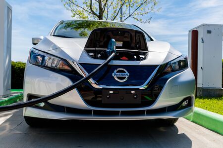 Pearland, Texas - March 21, 2018: New 2018 Nissan Leaf electric car plugged in to charge battery at the EVgo charging stationのeditorial素材