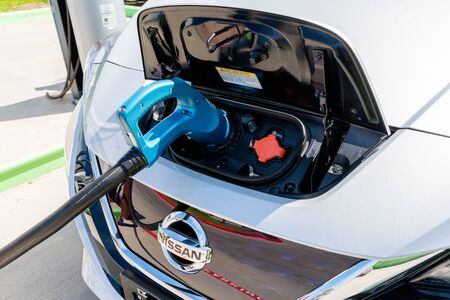 Pearland, Texas - March 21, 2018: New 2018 Nissan Leaf electric car plugged in to charge battery at the EVgo charging stationのeditorial素材