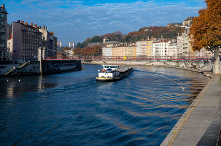 commercial barge going up the SaÃ´ne in Lyon