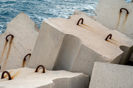 Concrete breakwater blocks arranged on the jetty of the port of Niceの写真素材