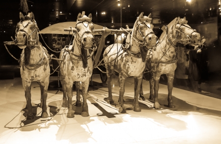 Statue of ancient Chinese styled carriage drawn by four horses. Stone and bronzeのeditorial素材
