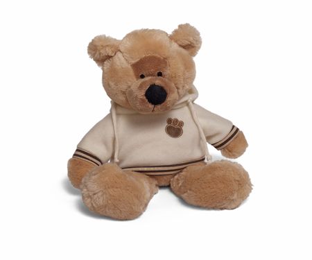 Isolated teddy bear sitting at white background. Soft children toy in warm jucketの写真素材