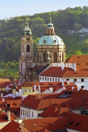 Prague classic view at roofs and dome cathedral in a sun beamsの写真素材