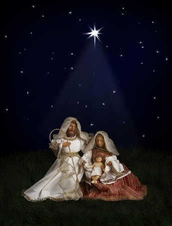Nativity scene with Mary, Joseph, baby Jesus on dark background with Christmas starの写真素材