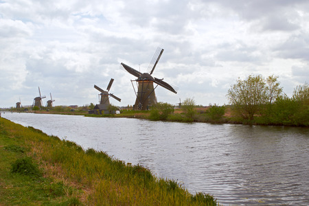 Traditional dutch windmill near the canal. Netherlands, Kinderdijkの写真素材