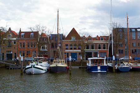 Ships in the port of Dodrecht Netherlands cloudy dayの写真素材