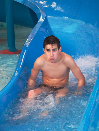 Boy on water slideの写真素材